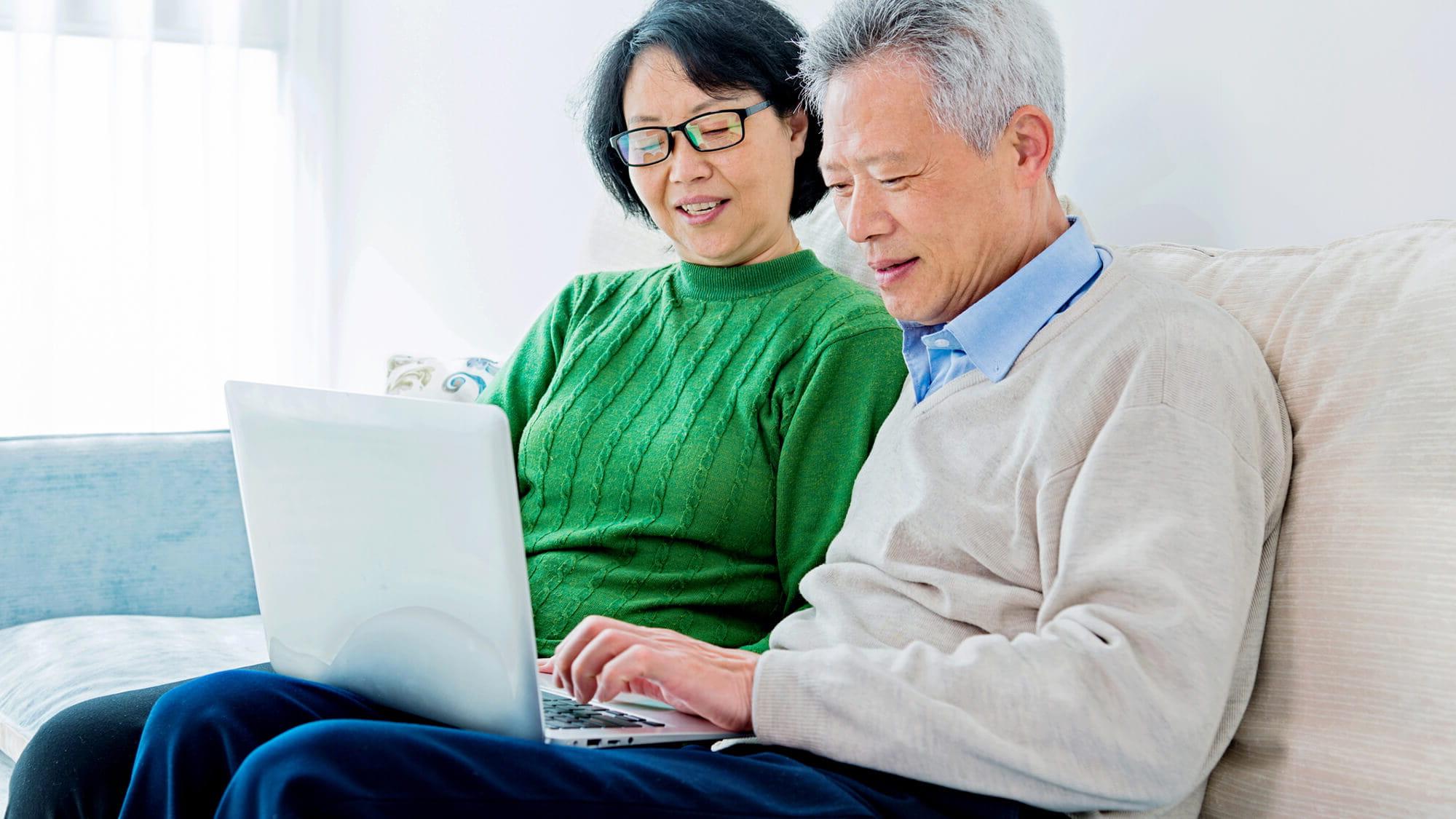 couple using laptop